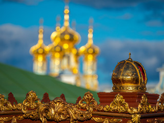 Saint Petersburg. Russia. The empire ball symbol, elements of park decoration on the background of the golden domes. Cultural heritage of Russia. Leningrad region. Pushkin. Petersburg tours.