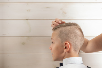 Obraz premium A 10-year-old boy prepares for school after a long summer break. Back to school. Children's portrait.