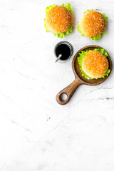 National american food concept with burgers and drink on marble background top view space for text