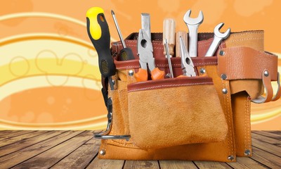 Tool belt with tools on light background
