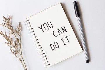 Written words you can do it on paper notebook with pen on white background.