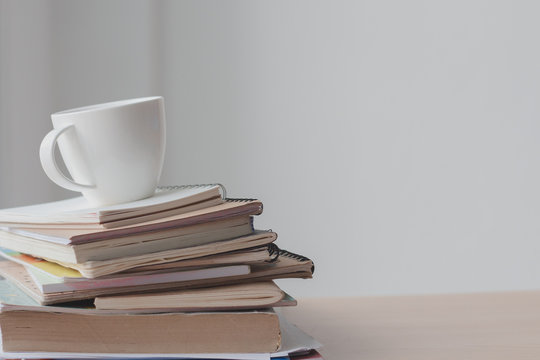 Cup Of Coffee With Stack Document On Office Desk.Copy Space.