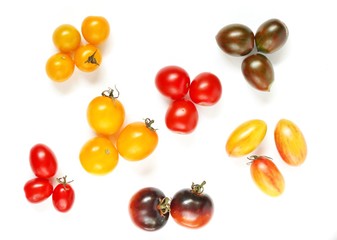 different varieties of cherry tomatoes. small tomatoes of different colors and types.