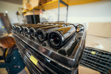 Bottles of wine on the racks of a production winery