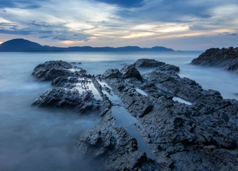 Sea dawn with waves and rocks at nha trang