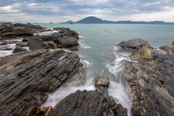 Sea dawn with waves and rocks at nha trang