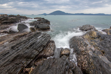 Sea dawn with waves and rocks at nha trang