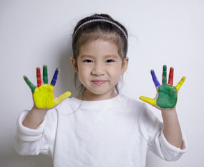 Kid's creativity, Child little asian girl hands painted in colorful paints on white background, Educational concept for school