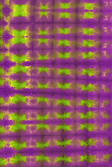 Abstract hand painted tie-dye  fabric purple background with plaid pattern in naïve traditional ethnic style