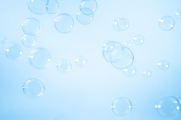 Blue soap bubbles background.