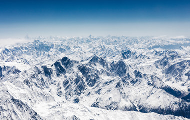 Aerial view of central Karakoram or Karakorum range in Pakistan, second highest mountain range in the world., with snowcapped mountains, peaks, valleys & glaciers.
