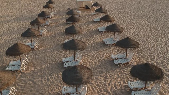 Beautiful and cinematic odeceixe beach umbrellas at vicentina coast, algarve