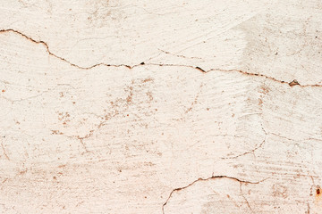 Texture of a concrete wall with cracks and scratches which can be used as a background