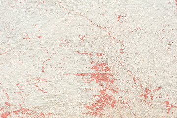 Fototapeta premium Texture of a concrete wall with cracks and scratches which can be used as a background