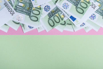 Euro cash on a pink and green background. Euro Money Banknotes. Euro Money. Euro bill. Place for text.