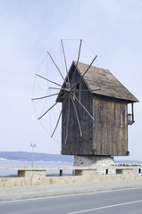 The wooden windmill is symbol of town Nessebar in Bulgaria