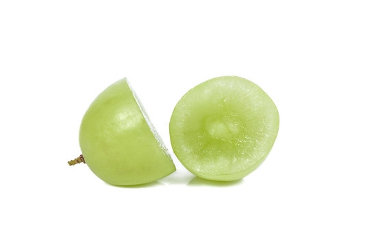 Green seedless grapes isolated on white background