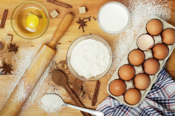 Fototapeta na wymiar Food ingredients for baking: flour, eggs, milk, sugar 