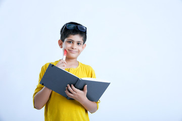 Obraz premium Young indian cute boy with notebook