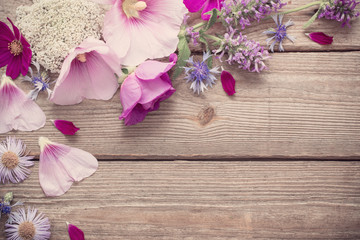 summer flowers on old wooden background