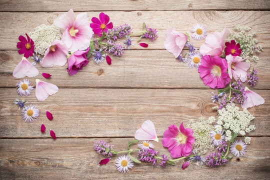 summer flowers on old wooden background