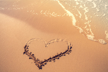 Inscription heart on the tropical sandy beach