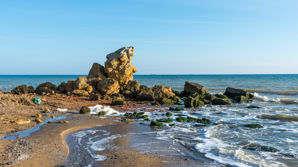 A scattering of large stones by the sea