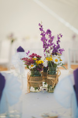 bouquet of flowers in vase on wooden table