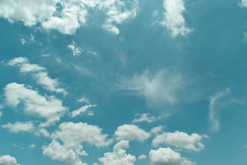 blue sky background with tiny clouds.