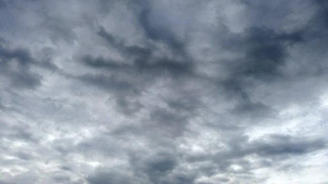 Grey sky with fast moving clouds. Motiontimelapse at the countryside in Germany.