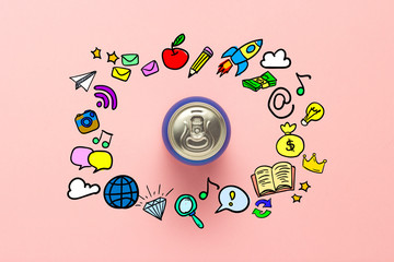Tin can with a drink on a pink background with icons. minimalism. Concept day and night, caffeine, energy drink, funny icons. Flat lay, top view