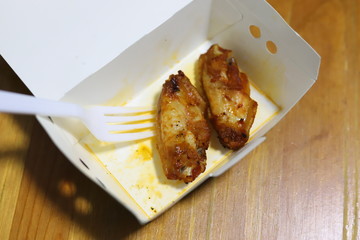 leftover fried chicken in box.