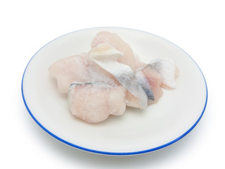 Fototapeta na wymiar Slice frozen fish on the round plate isolated on white background