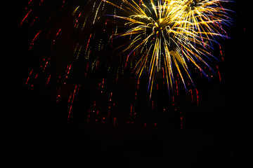 Awesome isolated Festive fireworks on a dark background. Can be used as wallpaper or background