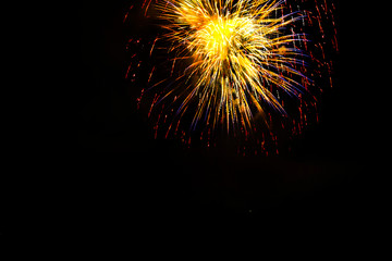 Awesome isolated Festive fireworks on a dark background. Can be used as wallpaper or background