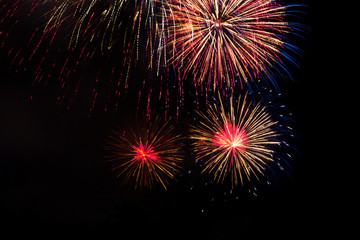 Awesome isolated Festive fireworks on a dark background. Can be used as wallpaper or background