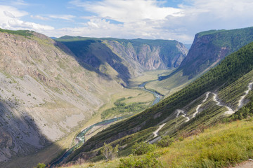 Fototapeta premium Valley of the river, top view. Altay mountains. Summer sunny day. Mountain car pass