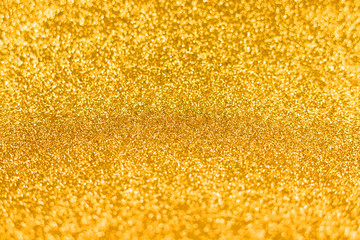 Bright sparkle golden background. Holiday and festive concept.