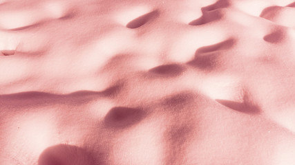 Trend photography on the theme of the new color of the year 2019 - Living Coral. texture of snow powder background.