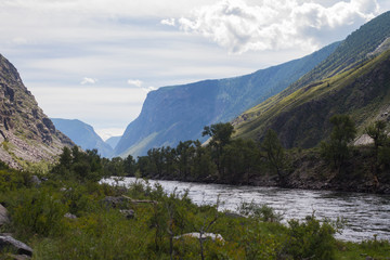 Chulyshman River in mountains valley. Picturesque landscape of Altai Mountains. Summer time.