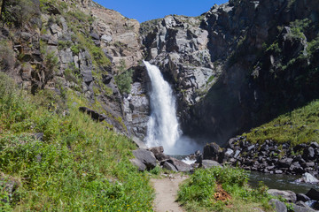 Waterfall in Altay mountains. Beautiful nature landscape. Popular touristic distination.