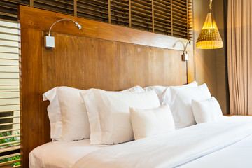 Beautiful luxury comfortable white pillow on bed and blanket decoration in bedroom