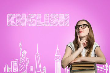 Young girl student with glasses leaning on a pile of books and looking up with a pensive face on a pink background with the text English. Concept of learning English and education in England