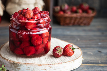 Strawberry jam in a glass jar
