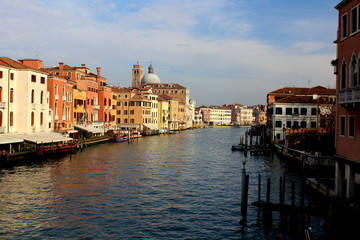 Fototapeta na wymiar Venezia, Italia, December 28, 2018 panoramic view of a Venice canal with a dome in the background