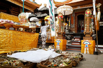 Balinese woman wearing traditional costume, sarong ,during ceremony in Bali-Indonesia
