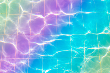 Fototapeta na wymiar Water vibrations in the swimming pool with sun reflection. blue swimming pool surface, water background in swimming pool. Flat lay, top view