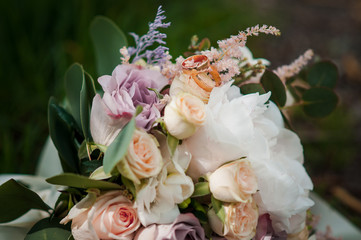 Bouquet of colorfull flowers lying on the grass