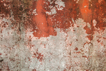 Old stone wall with plaster, worn paint and mold. Can be used as a texture, background or wallpaper