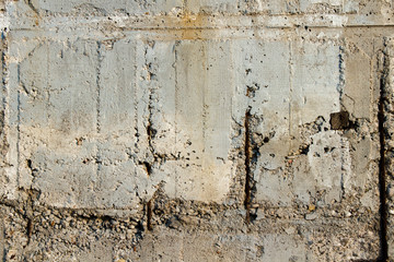 Concrete wall with rusty metal fittings. Can be used as a texture, background or wallpaper